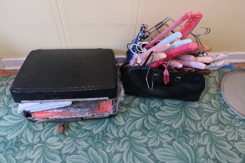 lot 131 image: SUITCASE WITH VINTAGE MATERIAL AND BAG WITH OLD HANGERS