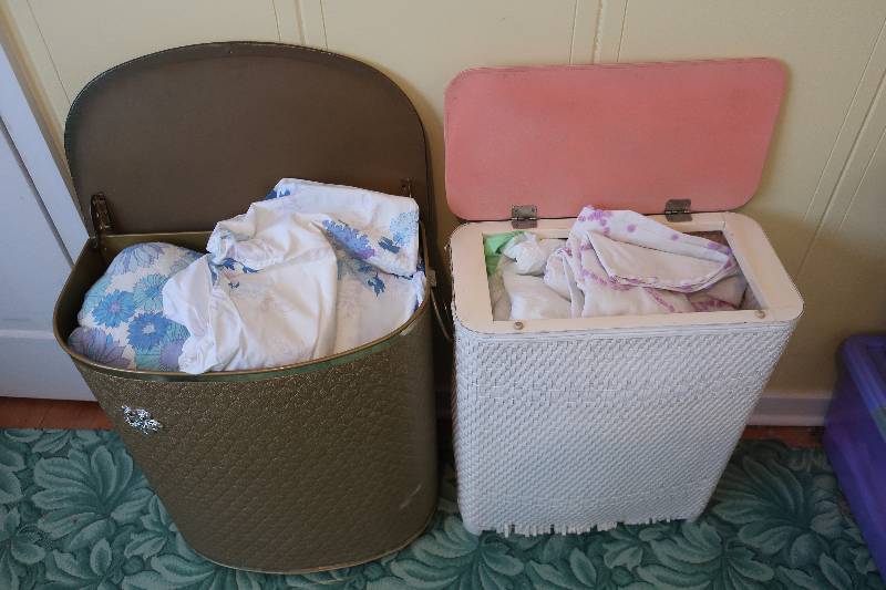 lot 136 image: 2 HAMPERS FULL OF BLANKETS, SHEETS, BEDSKIRTS AND MORE