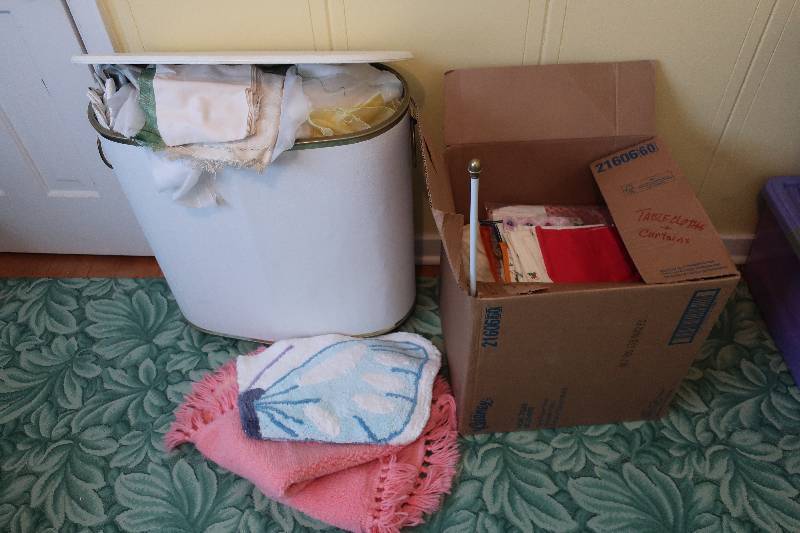 lot 137 image: HAMPER AND BOX FULL OF TABLE CLOTHS, CURTAINS AND MORE