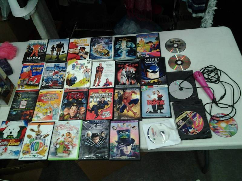 lot 13 image: Approximately 25-DVDs, 1-Karaoke CD & Microphone