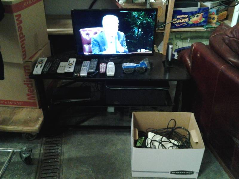 lot 16 image: Orion 24 Flat Screen TV (Works), With TV Stand 40x18x20, Box Of TV Related Cords