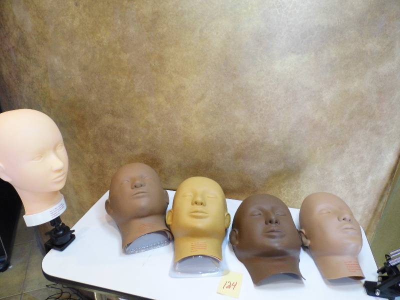 lot 124 image: Makep Head w Multiple Skin Tone Faces