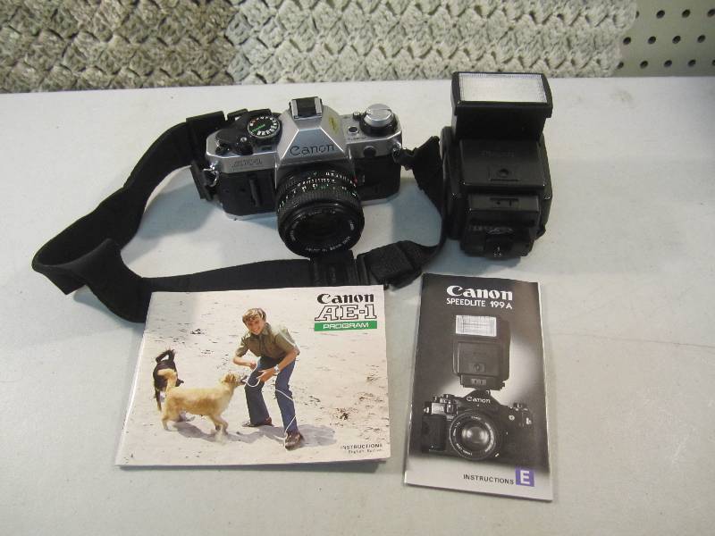 lot 84 image: Canon AE-1 Camera with Manual and C...