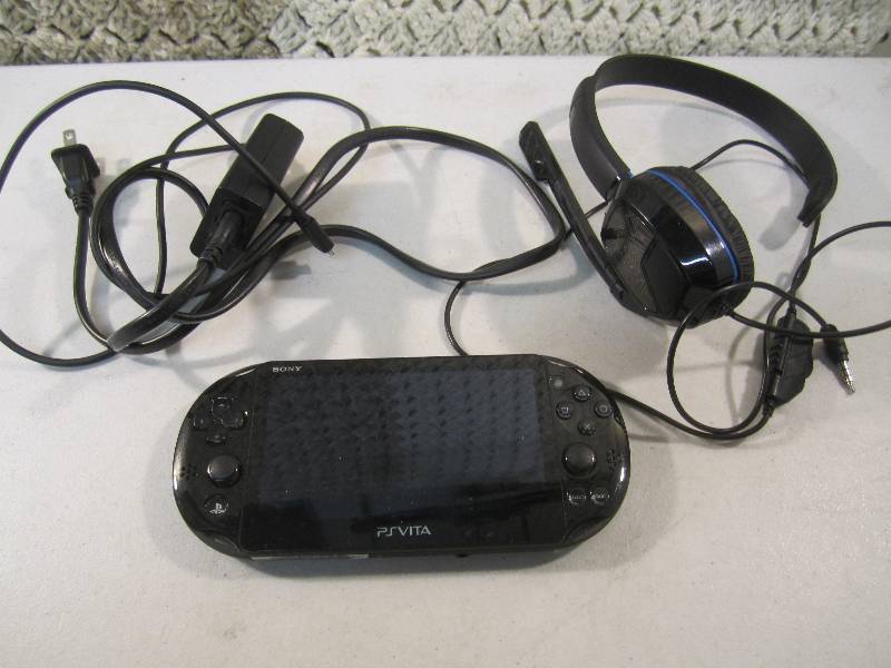 lot 97 image: Sony PSVista Handheld Game with Pow...