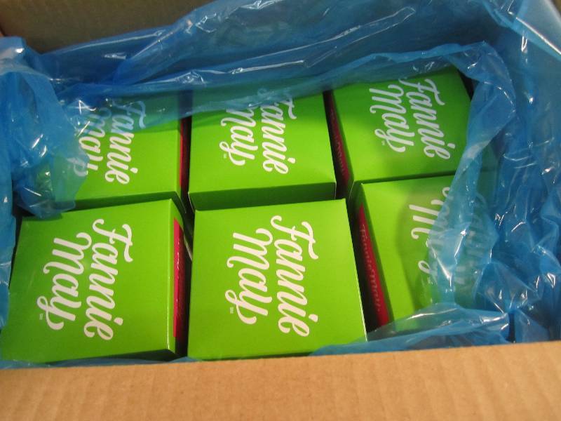 lot 297 image: Case of 6 Boxes Fannie May Mint Mel...