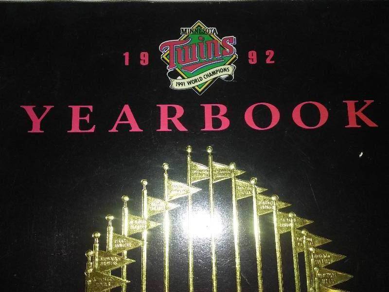 lot 127 image: Minnesota Twins 1992 Official Team Yearbook, World Series Trophy Cover