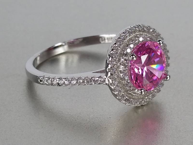 lot 82 image: Pink Sapphire Halo Ring