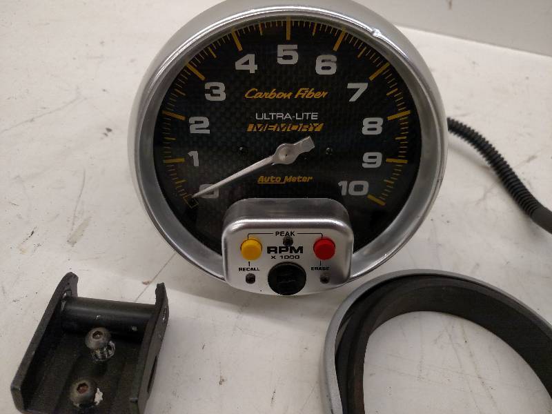 lot 251 image: 5 Auto Meter Recall Tach with Moun...