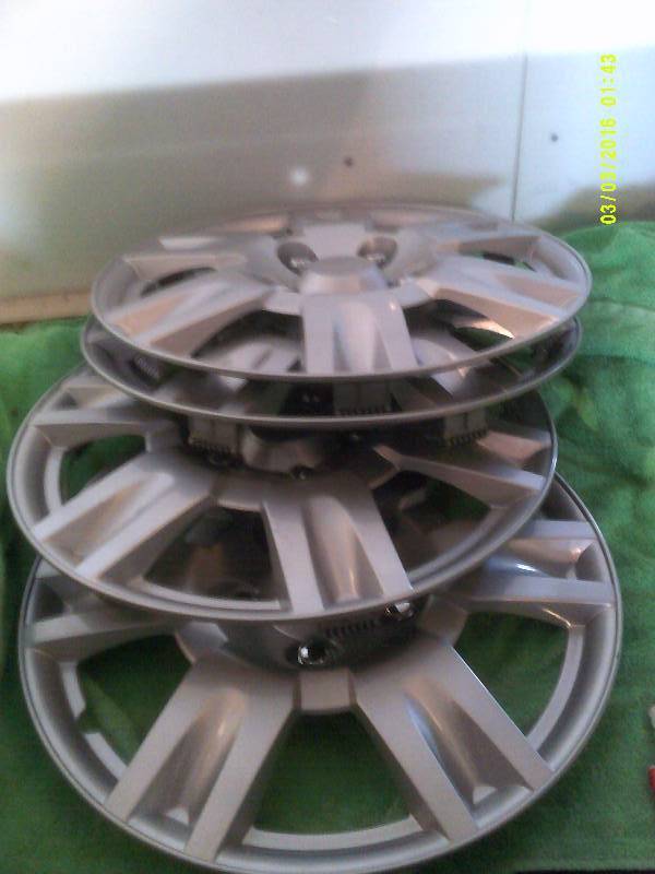 4 NEW HUB CAPS