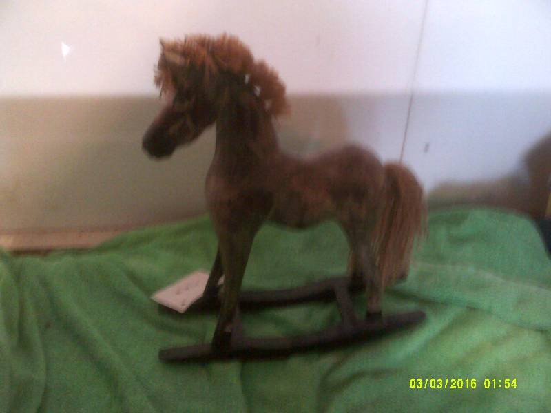 HAND CARVED AND PAINTED ROCKING HORSE
