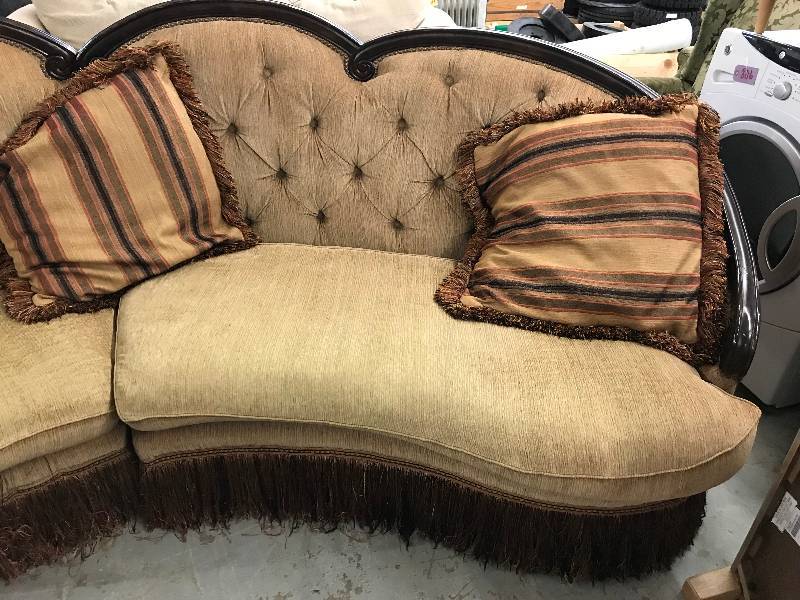 lot 818 image: CURVED, WOOD TRIM AND FRINGE BOTTOM SOFA