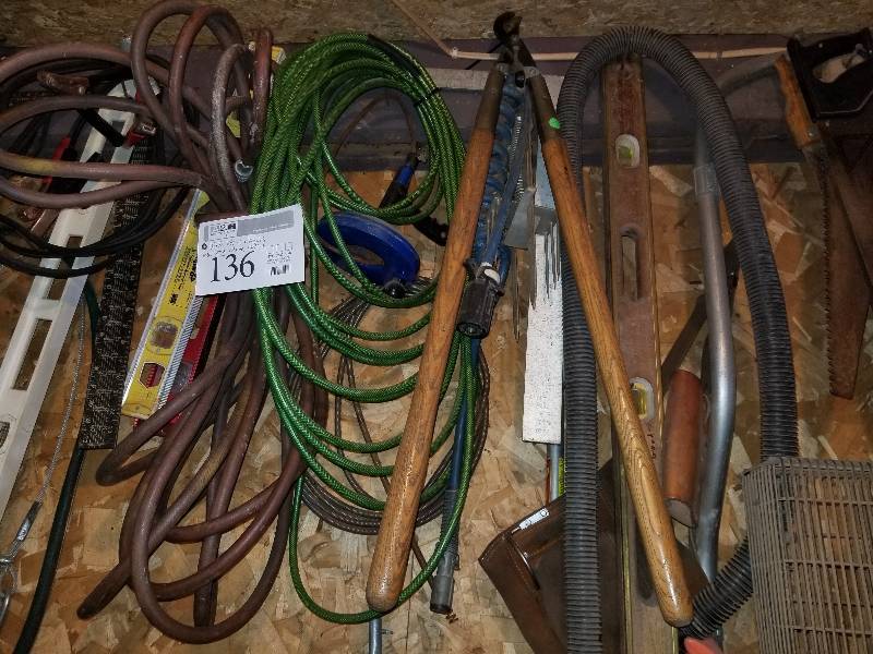 lot 136 image: Hand Saws, Loppers, Levels, Hoses, And More