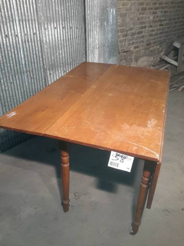 lot 58 image: Nice Drop leaf Dining Room Table.  Looks like Cherry Wood