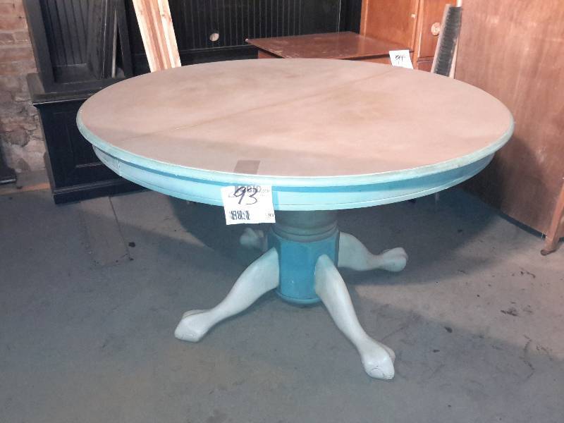 lot 93 image: 4 legged round table.. Solid