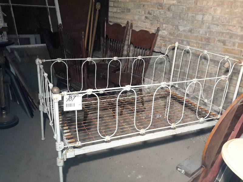 lot 101 image: vintage metal childs bed..