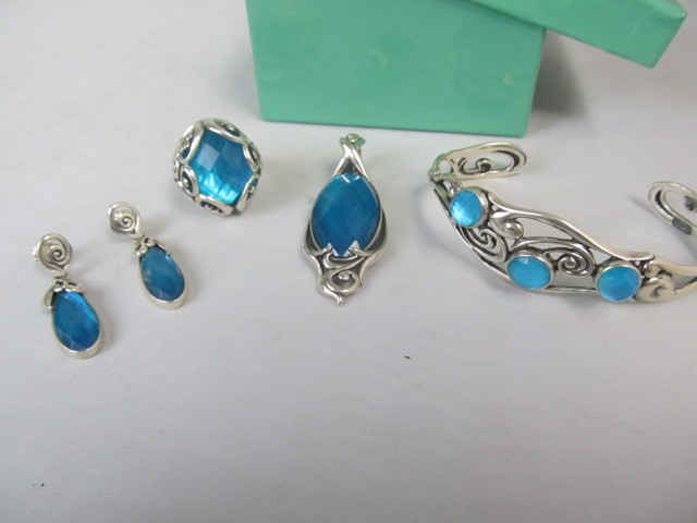 lot 24 image: Sterling Silver & Topaz Pendant Bracelet Ring & Earrings