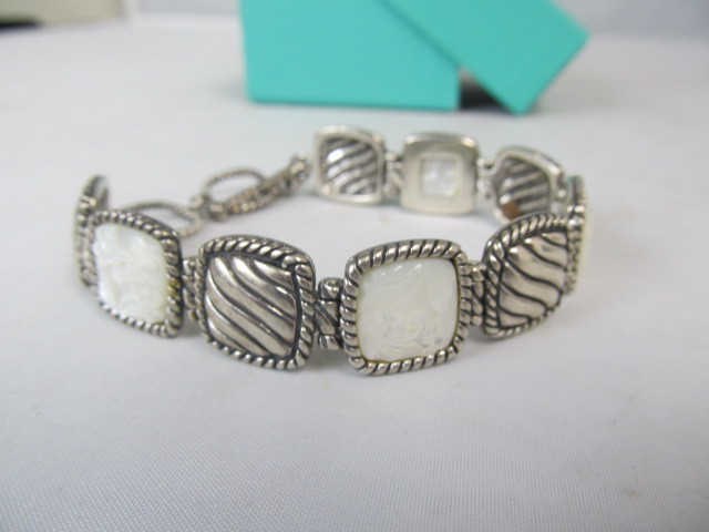 lot 43 image: Sterling Silver & Carved Mother Of Pearl Bracelet