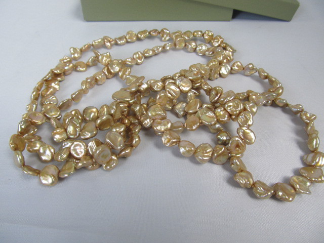 lot 123 image: Honora 64 Strand of Genuine Gold Colored Pearls