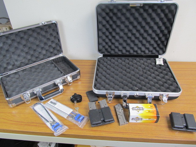 lot 134 image: 2 Nice Quality Handgun Hard Cases wGun accessories Magazines etc