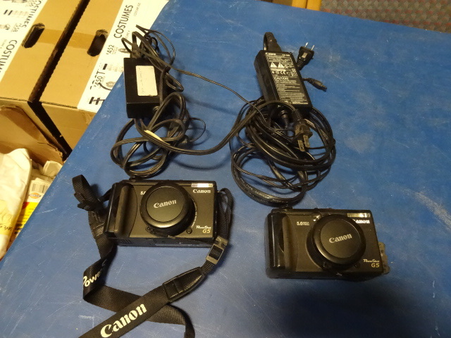 2 Canon G5 digital cameras. 2 power...