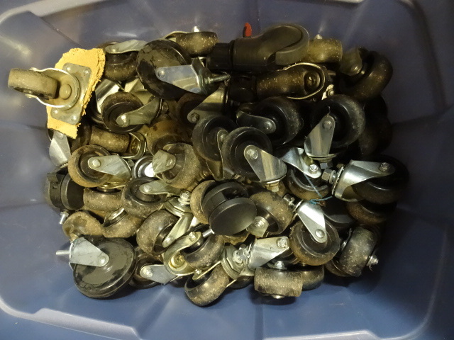 Large tote 12 full of casters. ...