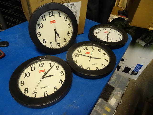 4 wall hanging clocks...