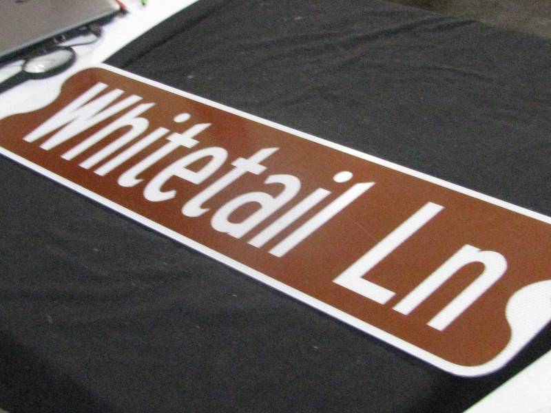 lot 83 image: Metal Whitetail Lane Sign