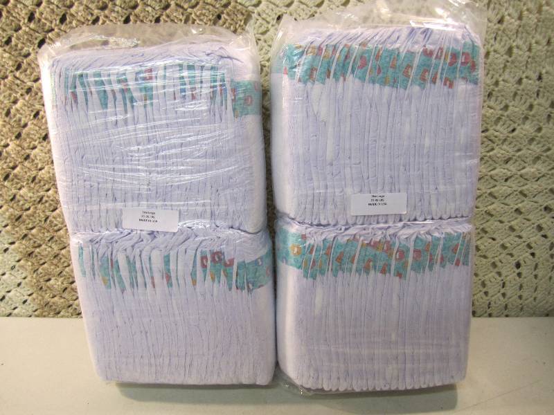 lot 283 image: Lot of 100 Size Large Diapers 2 pac...