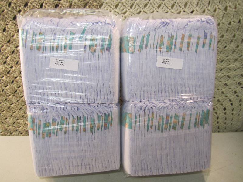 lot 285 image: Lot of 100 Size Medium Diapers 2 pa...