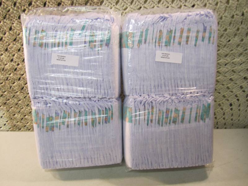lot 295 image: Lot of 100 Size Medium Diapers 2 pa...