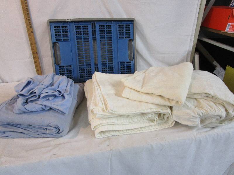 lot 102 image: Folding crate with Flannel Sheets great for painting