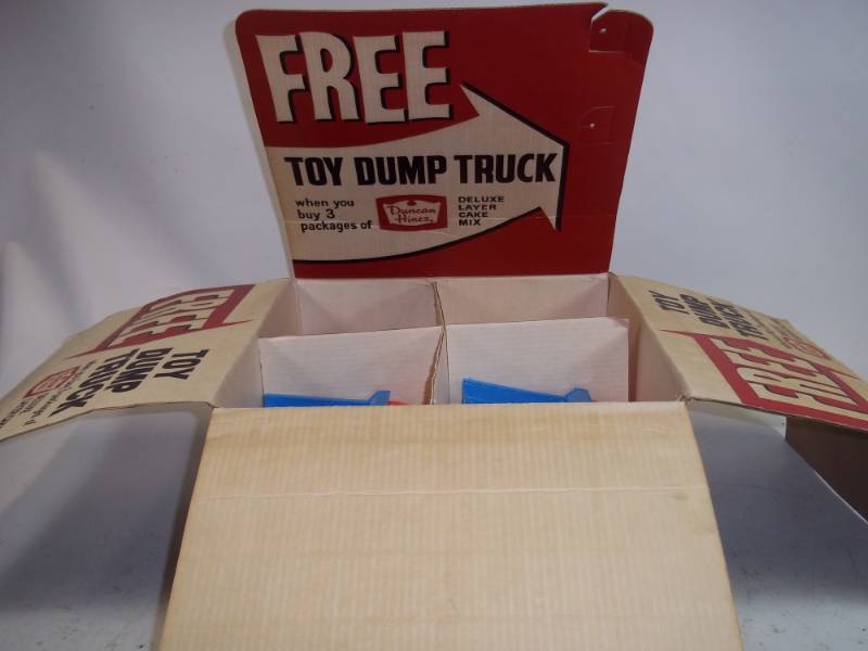 lot 32 image: Duncan Hines Toy Dump Truck includes 13 cars