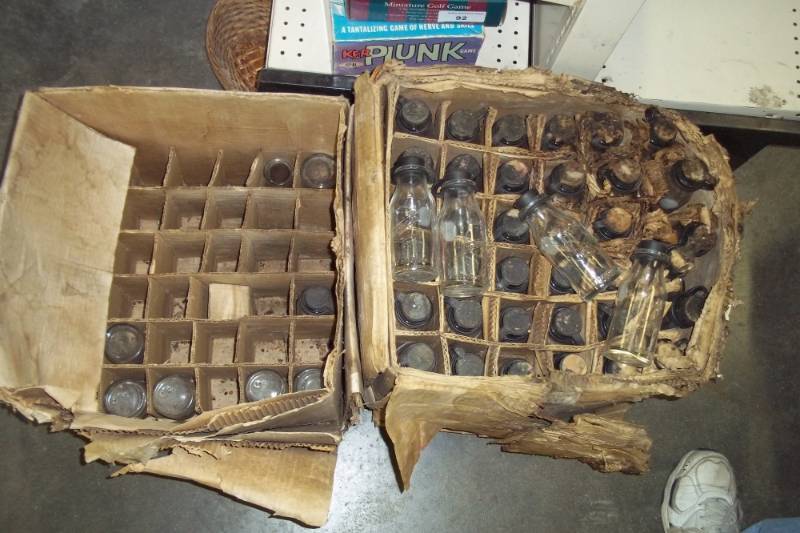 lot 96 image: Case of milk sample bottles with rubber stoppers