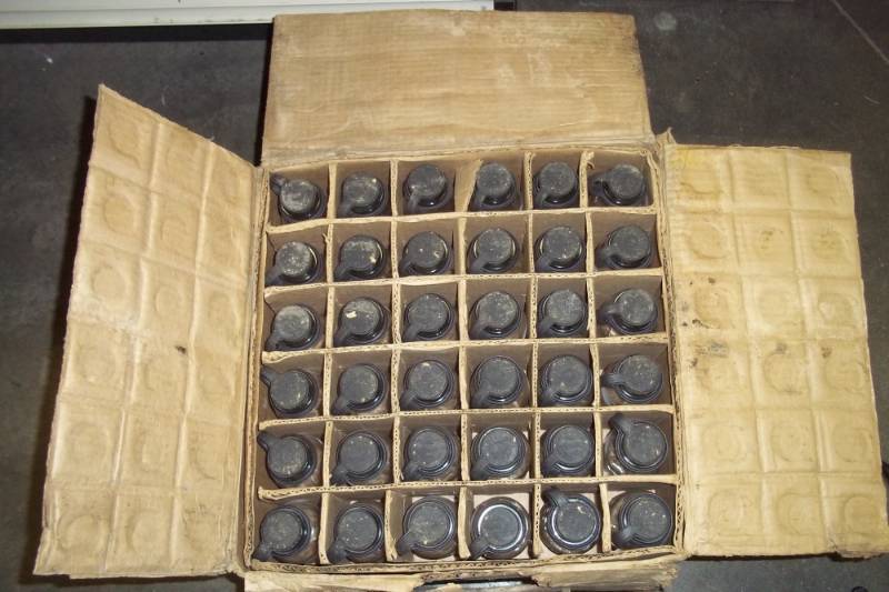lot 97 image: Case of milk sample bottles with rubber stoppers