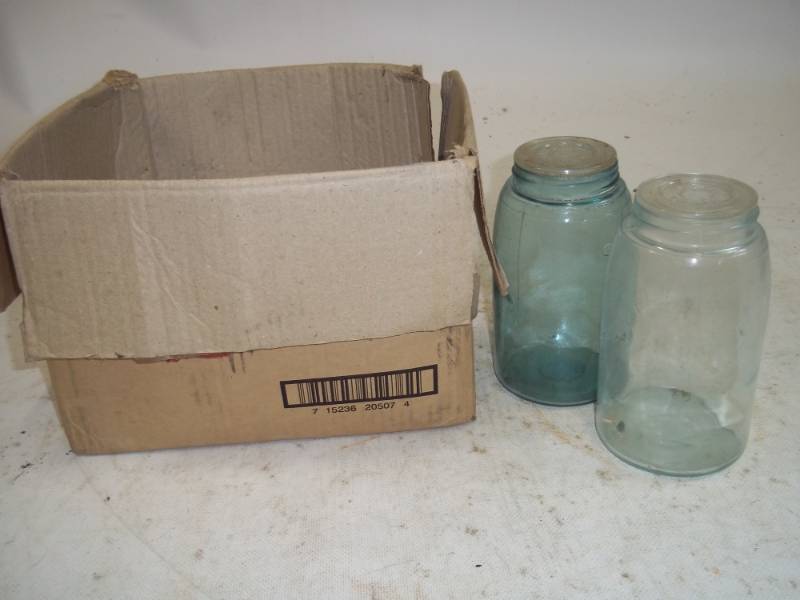 lot 98 image: Mason bottle glass lids with two mason bottles