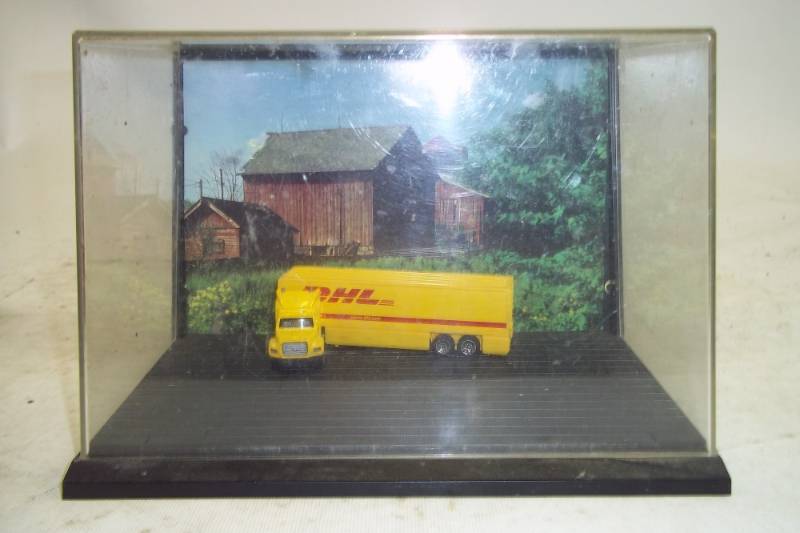 lot 107 image: Vintage Display Case with DHL semi truck