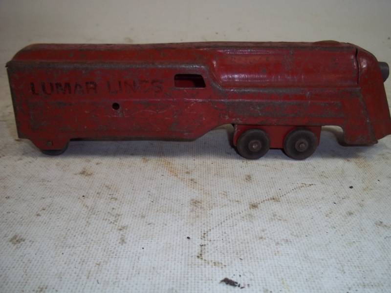 lot 138 image: Lumar Lines Vintage Toy Train Car tin train, wood wheels