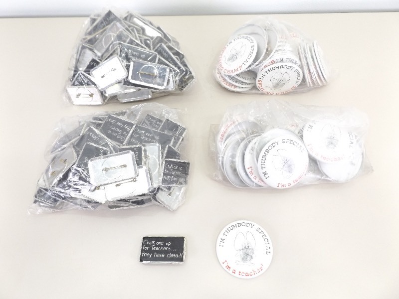 lot 18 image: Large Lot of Teacher Themed Buttons