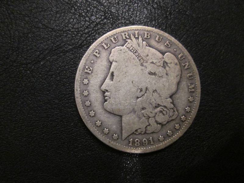 lot 10 image: 1891 O Morgan Dollar...