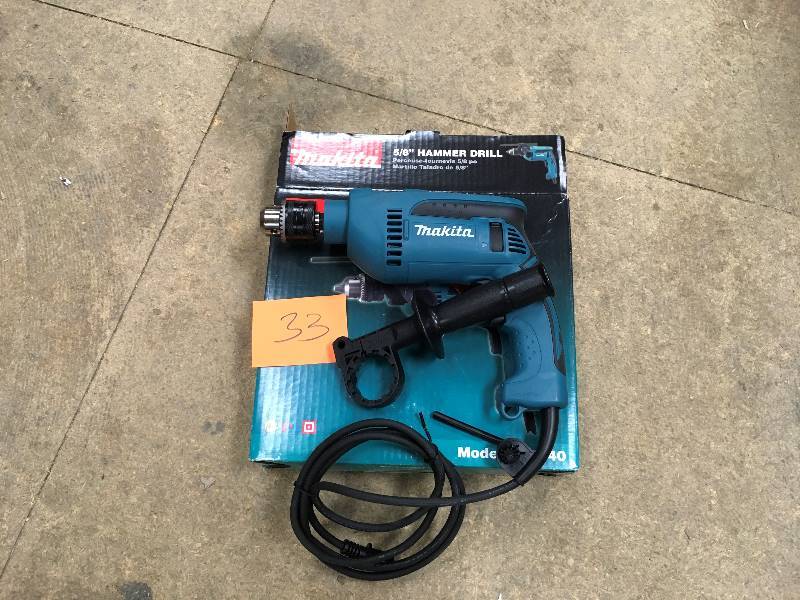lot 33 image: Makita HP 120 Volt 58 Cordless Hammer Drill  open box not used
