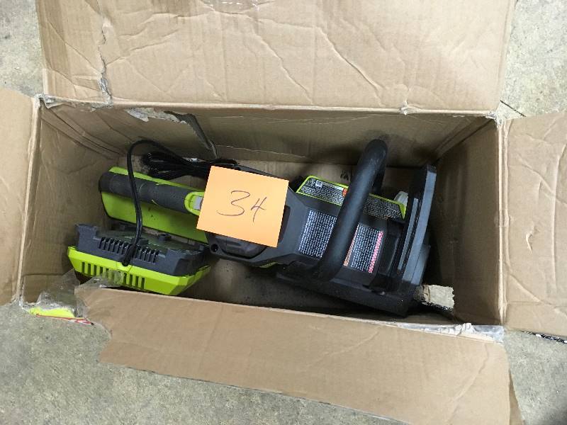 lot 34 image: Ryobi 14 in. 40 Volt Brushless Lithium-Ion Cordless Chainsaw 1.5 Ah Battery and Charger Included  open box not used