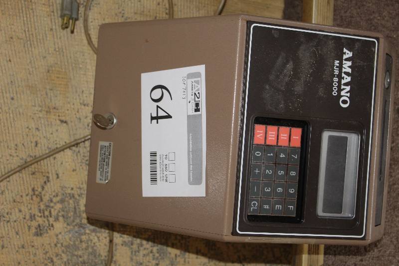 lot 64 image: Amano computerized calculating electronic time clock with manuals.
