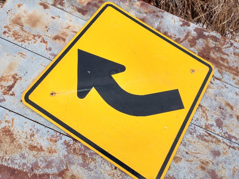 lot 9 image: Right Curve Ahead Sign