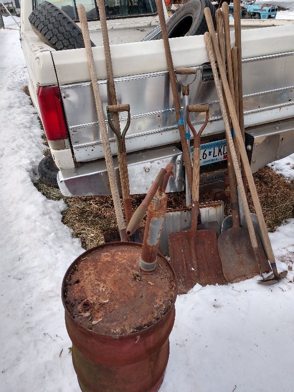 lot 51 image: Oil Drum and Pump, Shovels, &nbspand Primitive Garden Tools