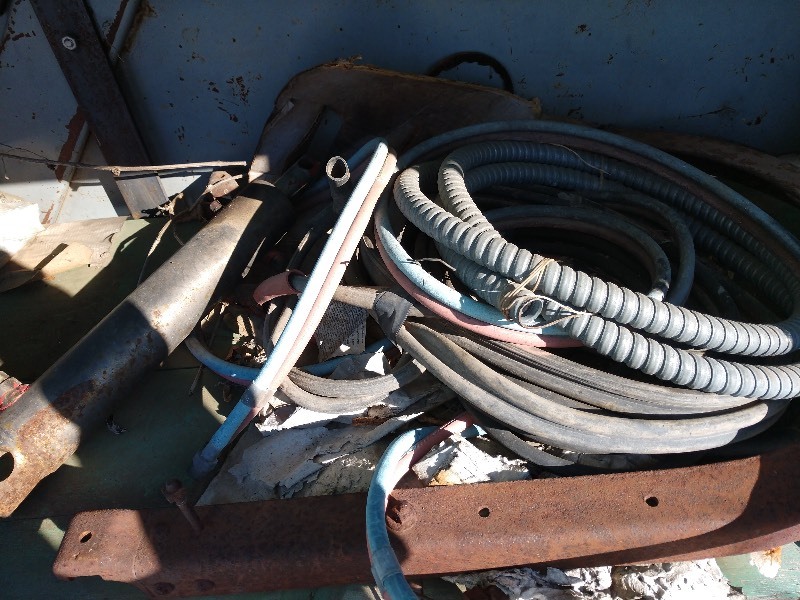 lot 87 image: Electrical Wire, Air Hose, ISKY Racing Cams Tin Container, and Industrial Salvage