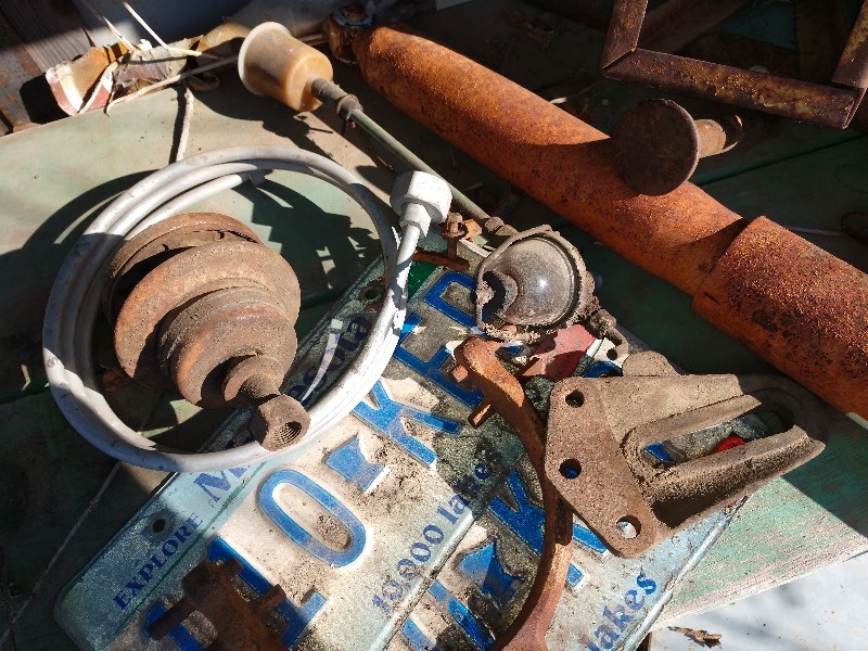 lot 88 image: Salvaged Parts, License Plates, Antique Oil Can, Jack, Pulley