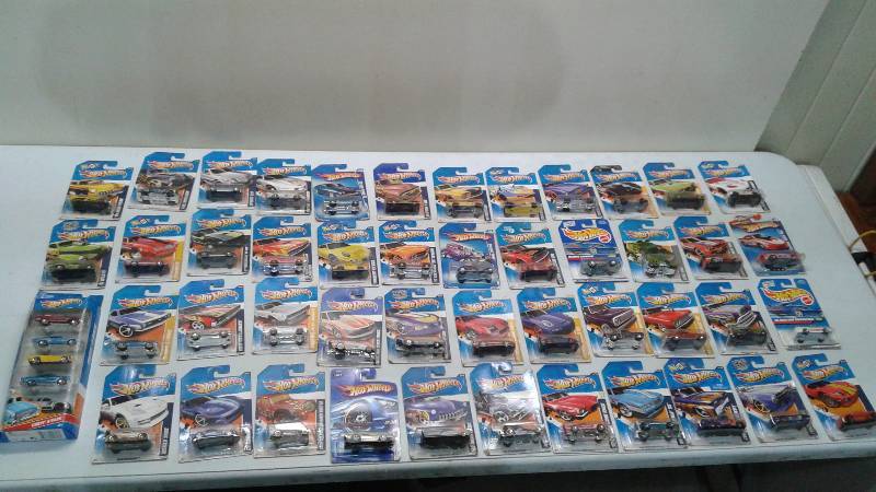 Over 50 Hot Wheels Cars New In The Package, Packages May Show Minor Wear, On Package Is A 5 Pack Of Cars