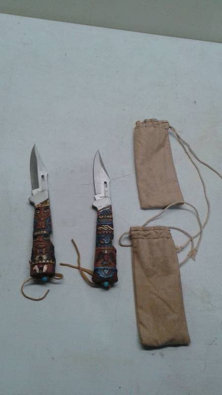 Pair Of Totem Pole Handle Pocket Knives