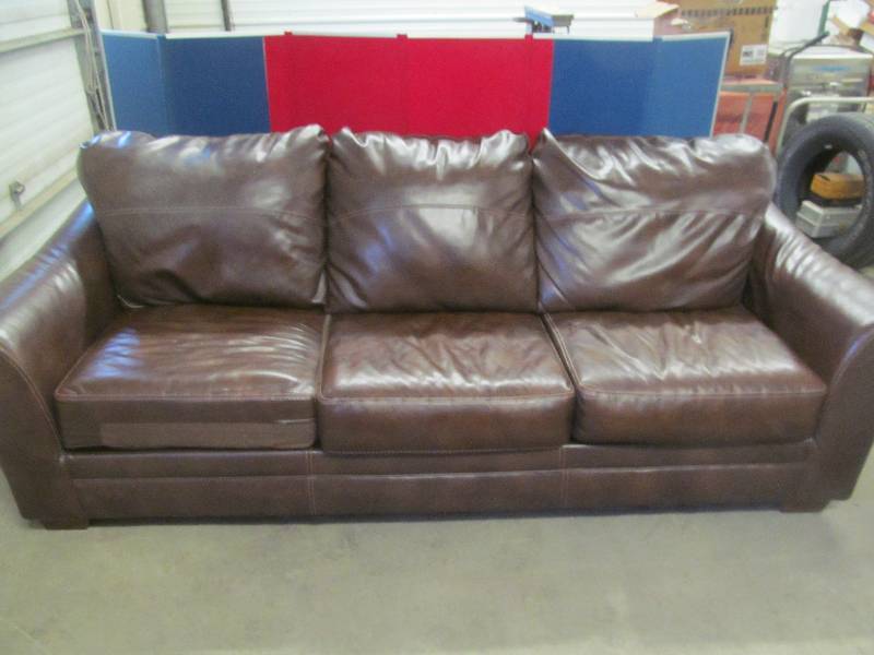 lot 208 image: Faux leather sofa