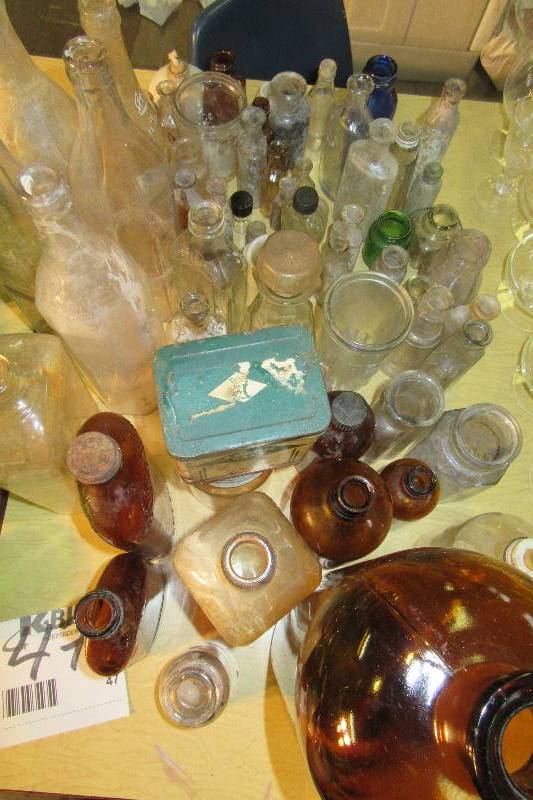 Large lot of vintage medicine and other types of bottles and containers